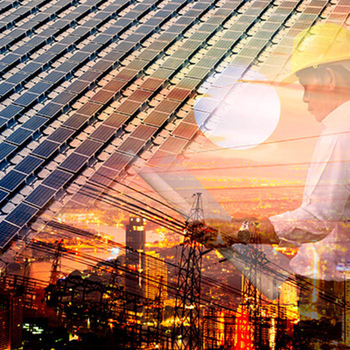 Graphic of man looking at blueprints with solar panels and industrial structure in the background