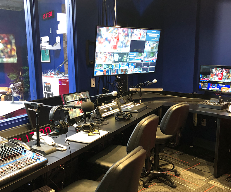 a podcast studio multicamera live video production control room for livestreaming broadcast and OTT with multiviewer visible comms and AW-RP150 roboitc pro ptz controller