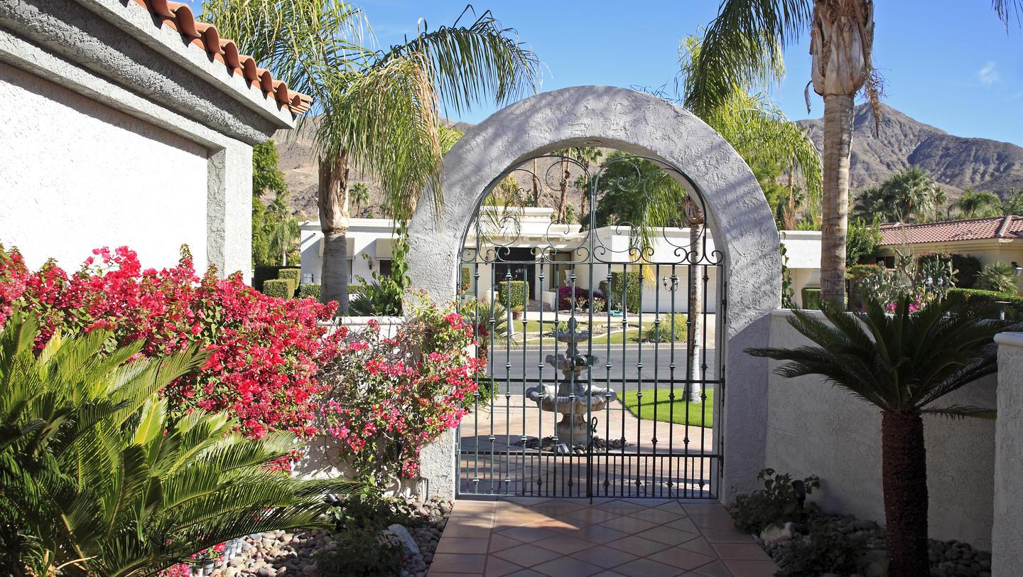 Inside Luxurious Xeriscaped Courtyard Looking To Street